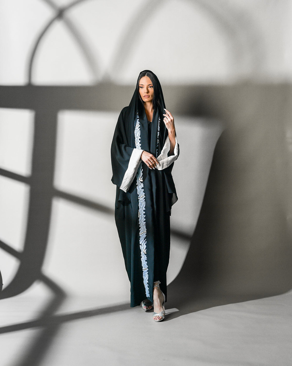 Khuyout Abaya in black crepe, sky-blue embroidery